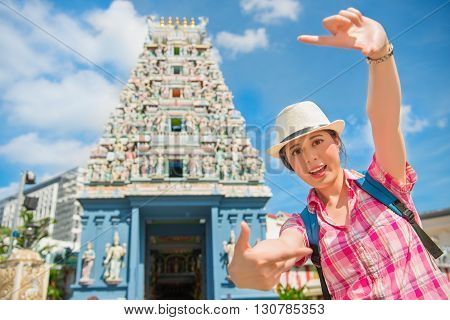 Happy Young Woman Framing In Sri Mariamman Temple, Singapore