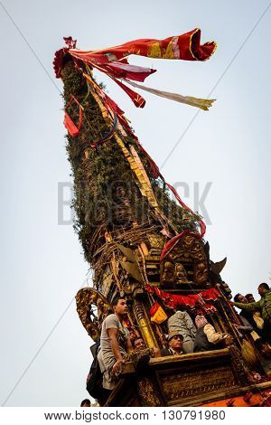 PATAN, NEPAL - MAY 19, 2016: God of rain Rato Machhindranath chariot festival. Rato Machhindranath is worshiped as the god of rain. The chariot is pulled through the street of Patan for about a month.