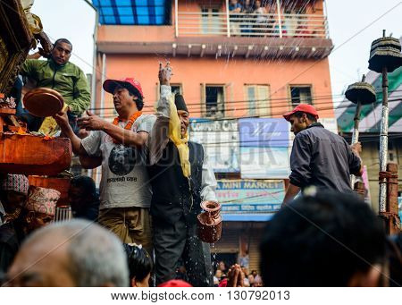 PATAN, NEPAL - MAY 19, 2016: God of rain Rato Machhindranath chariot festival. Rato Machhindranath is worshiped as the god of rain. The chariot is pulled through the street of Patan for about a month.