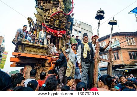 PATAN, NEPAL - MAY 19, 2016: God of rain Rato Machhindranath chariot festival. Rato Machhindranath is worshiped as the god of rain. The chariot is pulled through the street of Patan for about a month.