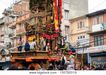 PATAN, NEPAL - MAY 19, 2016: God of rain Rato Machhindranath chariot festival. Rato Machhindranath is worshiped as the god of rain. The chariot is pulled through the street of Patan for about a month.