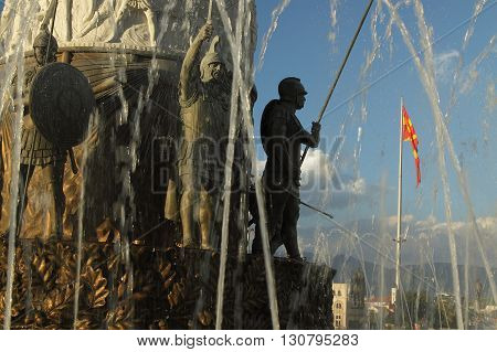 Macedonia Skopje detail of the Alexander the Great monument-fountain Macedonian national flag in the background