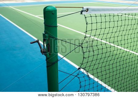 Poles and nets in the tennis court.