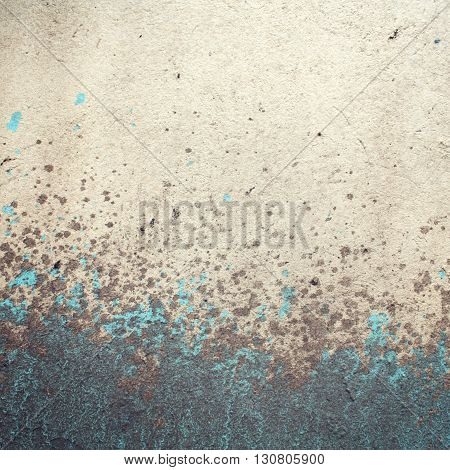 Frame for text. Urban wall close-up. Paint and mud on concreat surface. Aged photo. Retro photo. Vintage effect. Street wall close up. Macro photo background. Toned filter.
