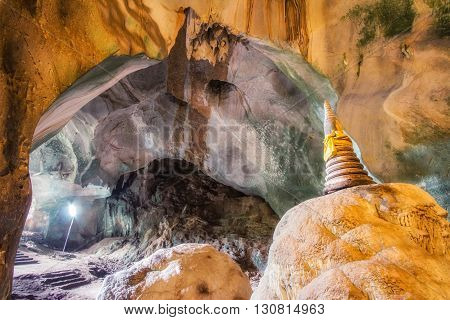Amazing view of Buddhist Pagoda at the cave in temple of Thailand