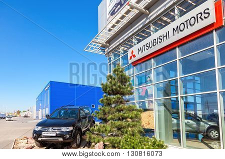 SAMARA RUSSIA - MAY 14 2016: New car Mitsubishi Pajero Sport parked up near the office of official dealer Mitsubishi. Mitsubishi Motors Corporation is a multinational automotive manufacturer