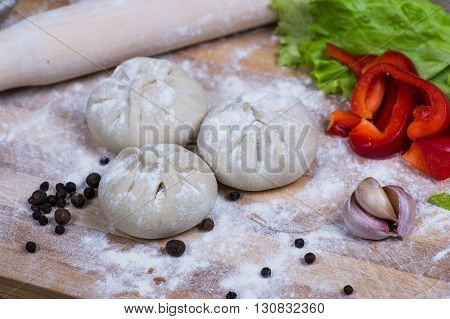 Caucasuan cuisine - Khinkali with meat served green koriander leaves.