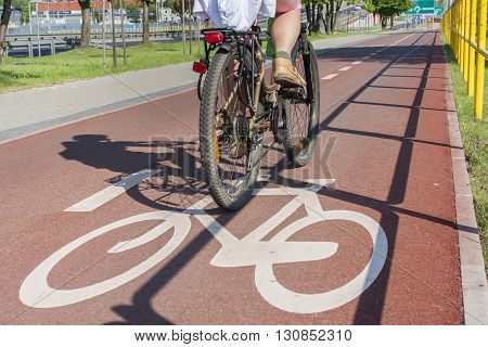 Bicycle road sign and bike riders bicycle path in the city center.