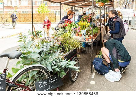 London United Kingdom - April 30 2016: Druid Street market in Bermondsey (located in railway arches). Great artisan street food stalls and bars. Florist stall