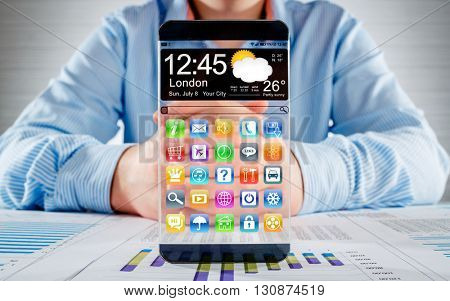 Futuristic Smart phone (phablet) with a transparent display in human hands. Concept actual future innovative ideas and best technologies humanity.