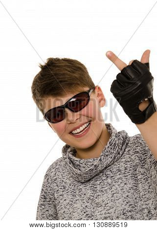 Cheeky boy with an unkind gesture on a white background