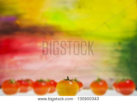 Few Fresh tomatoes and a colorful background