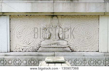 bas relief of buddha in mendut buddhist monastery