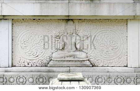 bas relief of buddha in mendut buddhist monastery