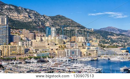 Bright cityscapeof Monaco rising from the Mediterranean bay