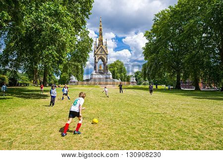 London England - July 3 2008: Boys playng football near the Albert Memorial