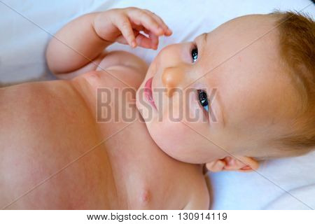 Baby is laughing on a white background