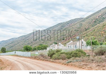 BAVIAANSKLOOF SOUTH AFRICA - MARCH 6 2016: The road through Baviaanskloof (baboon valley) with the police station and living quarters to the right