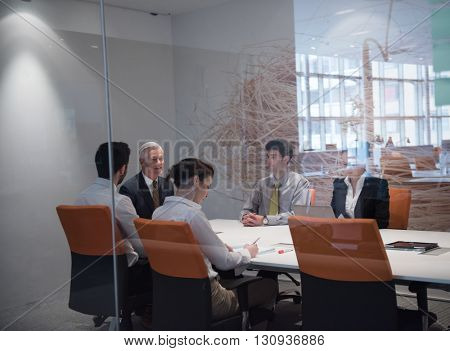 business people group brainstorming on meeting and businessman presenting ideas and projects oon laptop and tablet computer