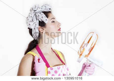 Pretty Cleaning Lady Refreshing Herself With A Fan