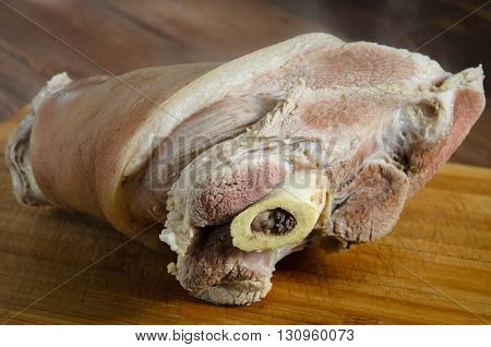 Boiled pork Knuckle on a wooden table