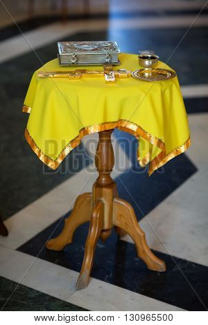 Bible and cross on a table in the church