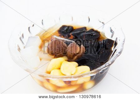 Traditional chinese dessert a delicious bean and herb in longan syrup with ice