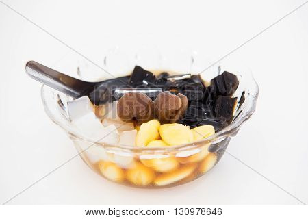 Traditional chinese dessert a delicious bean and herb in longan syrup with ice