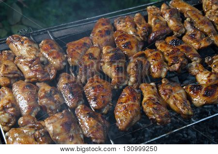 grilled chicken wings on the grill grate barbecue