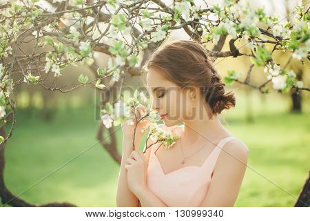 spring , summer beauty portrait of brunette girl in pink dress