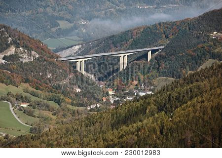 Alpine valley with highway viaduct