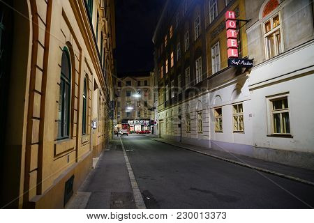 Vienna,austria - September 5 2017;  Illumiated Red Hotel Sign And Buildings Line Inner City Night St