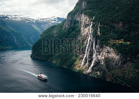 Breathtaking view of Sunnylvsfjorden fjord and famous Seven Sisters waterfalls, near Geiranger village in western Norway.
