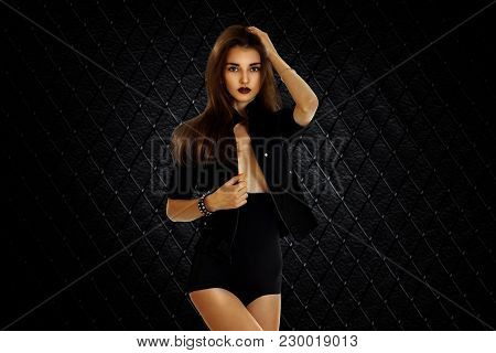 Beautiful Sexy Woman In Black Dress Posing On Camera Isolated On White Background
