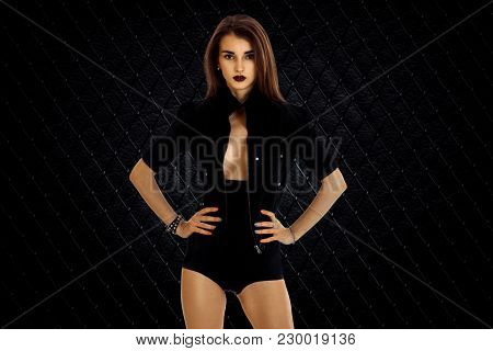 Serious Woman In Jacket And High Panties Posing On Camera Isolated On White Background