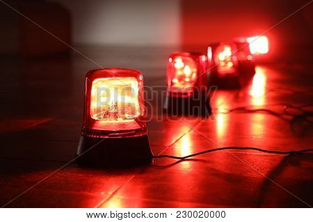 Background With Big Red Flashing Alarm Lights.