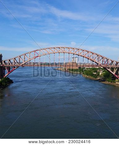 Railroad Bridge Spanning The River On A Sunny Day