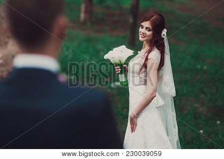Charming Bride Looks At Groom With Love