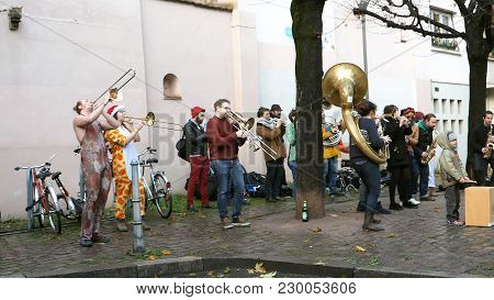 Strasbourg, France - Jan - 12, 2018: Street Music Orchester Dressed In Funny Clothes On The Streets 