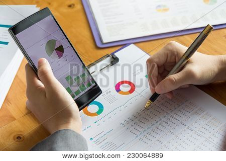 Business And Finance Concept Of Office Working, Businessman Using Smart Phone And Discussing Sale An