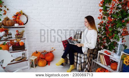 Cute And Confident Young Woman Doing Work On Errors And Recheck Adjustments In Control Work, Sitting