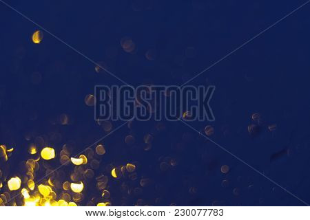 Golden Bokeh With Rain On Car’s Window.