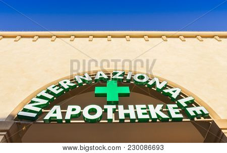 Italian Pharmacy Sign And Shop. Pharmacy Sign In German Language. Green Color Teaches.