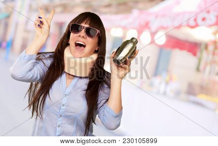 Woman Wearing Neckbrace Holding A Shaker, Outdoor