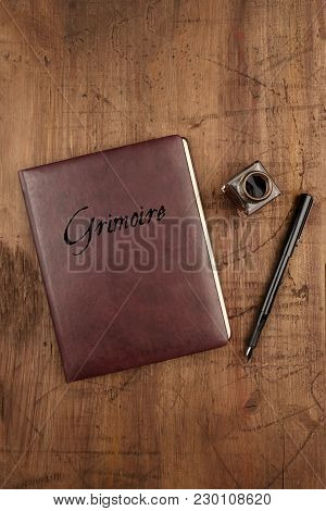 Leather Bound Journal Titled Grimoire, And Ink Well And Pen