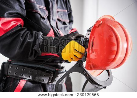 Importance Of Wearing Protection Equipment. Construction Site Theme. Worker With Hard Hat And Face P