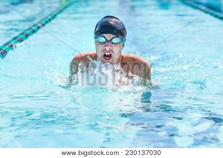 Breaststroke swimmer in a race