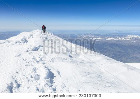Mountaineering Ascending To The Top Of Mount Mont Blanc In French Alps