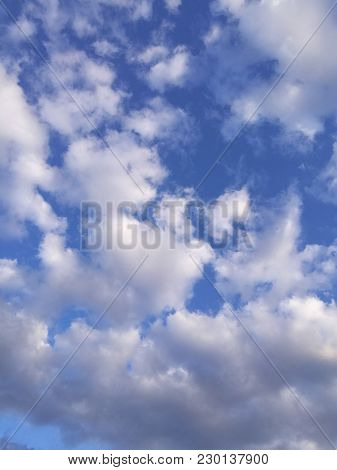 Blue Sky And White Clouds. Background Heaven.