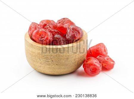 Red Dry Cherries In A Wooden Bowl Isolated On White Background